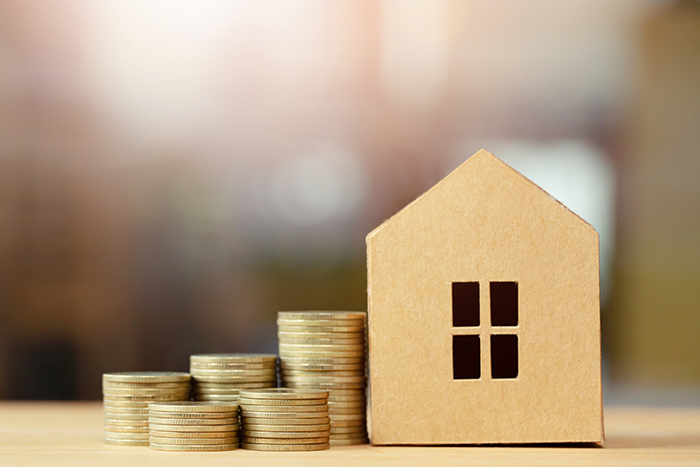 sell house fast scotland image of house with stacked coins